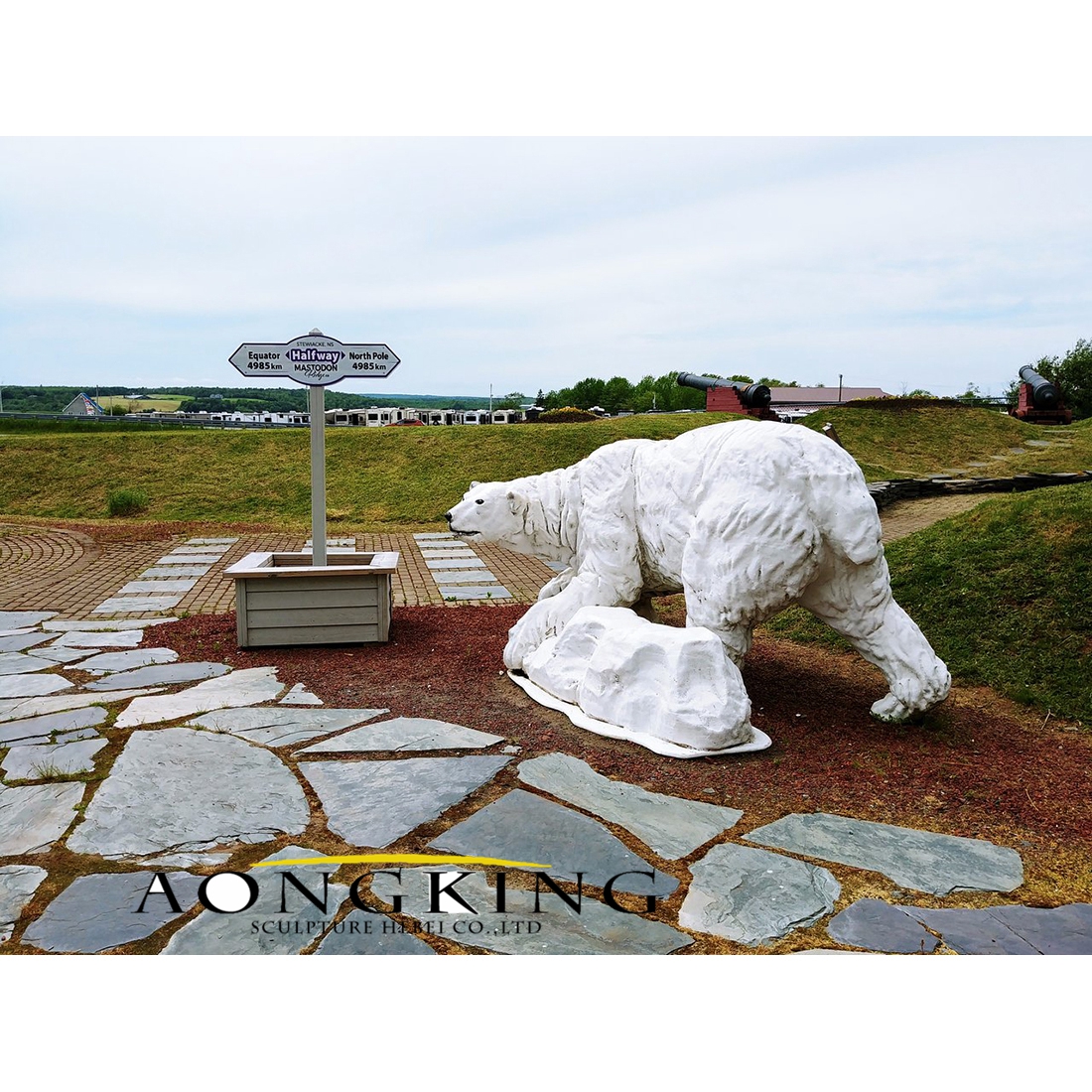 White fiberglass polar bear statue